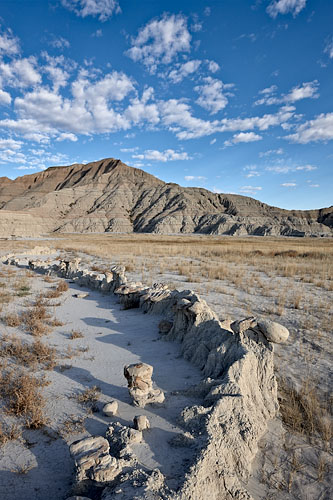 Badland Curve And Clouds